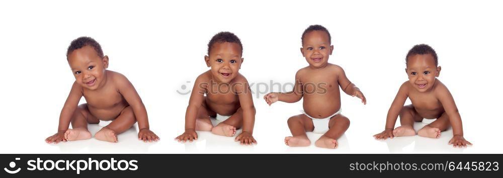 Four funny african baby sitting on the floor isolated on white background