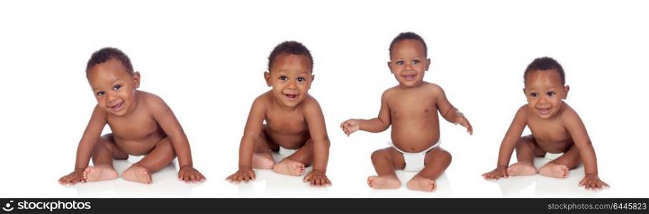 Four funny african baby sitting on the floor isolated on white background