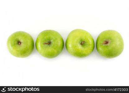 Four green apples in a row
