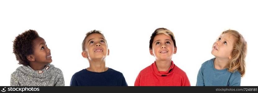 Four happy children looking up isolated on a white backround