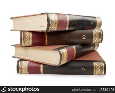 four heavy book tomes isolated, studio shot