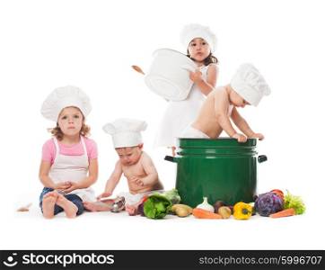 Four kids play with vegetables and kitchenware, cooking the soup