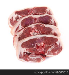 four lamb chops in front of white background