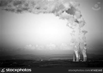 Four massive smoke stacks from a coal fired power station