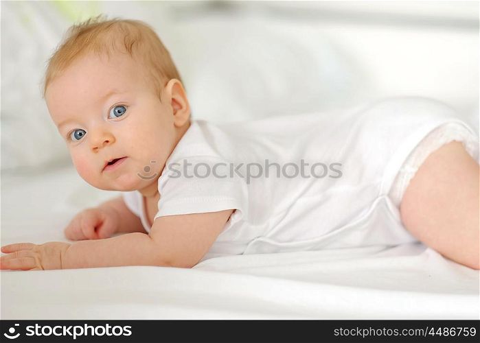 Four months old baby in bed