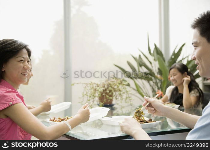 Four office workers having lunch in an office