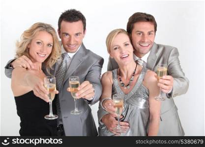 Four people celebrating