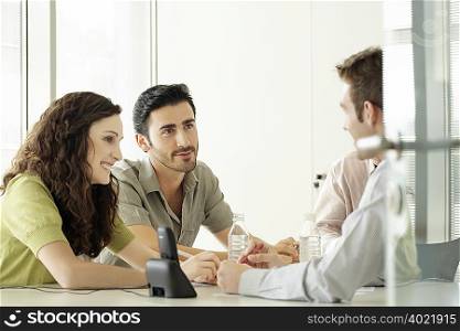 Four people in a meeting