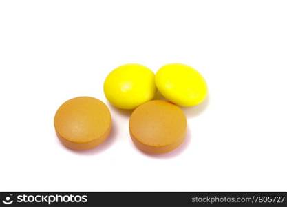 Four pills isolated on white