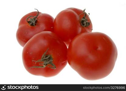 Four ripe tomatoes isolated on white background.