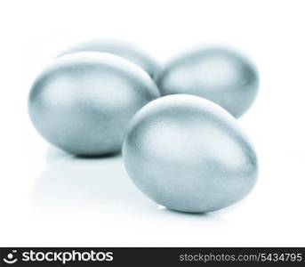 Four silver eggs isolated on white background