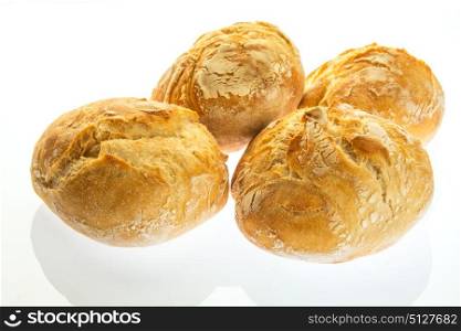 four small bread with round shape made on wood stove
