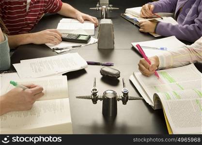 Four students working in a classroom