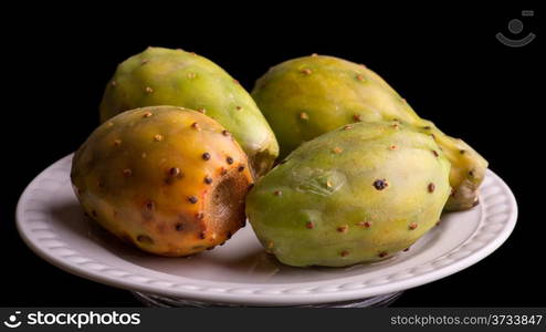 Four tasty prickly pear cactus fruits served on a plate