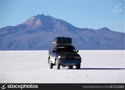 Four wheel drive car in the Salt desert Uyuni in Bolivia