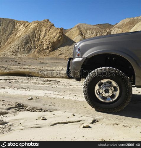 Four wheel drive truck in desert landscape in Death Valley National Park.