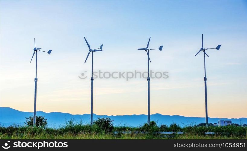 Four wind turbine in the sunset.