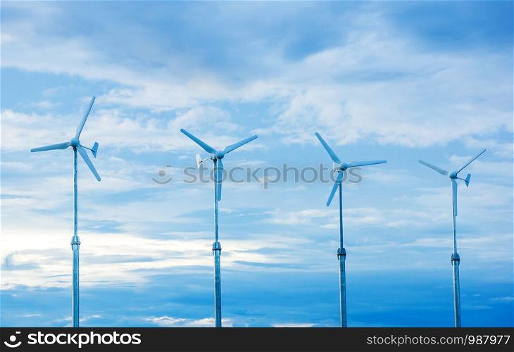 Four wind turbine in the sunset.