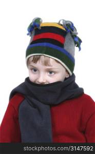 Four year old boy in crazy looking winter cap and a red sweater.