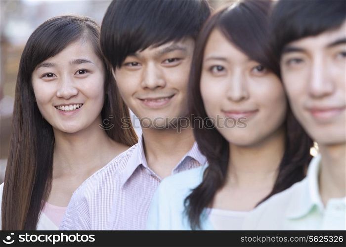Four Young People Standing in a Row in Beijing