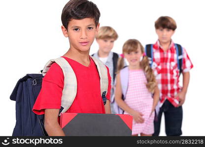 Four young schoolchildren