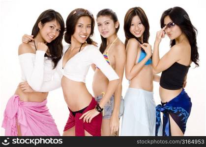 Four young women and a teenage girl posing