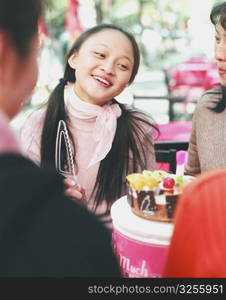 Four young women celebrating in a restaurant