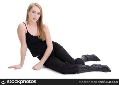 Fourteen year old girl in black sitting on white floor.