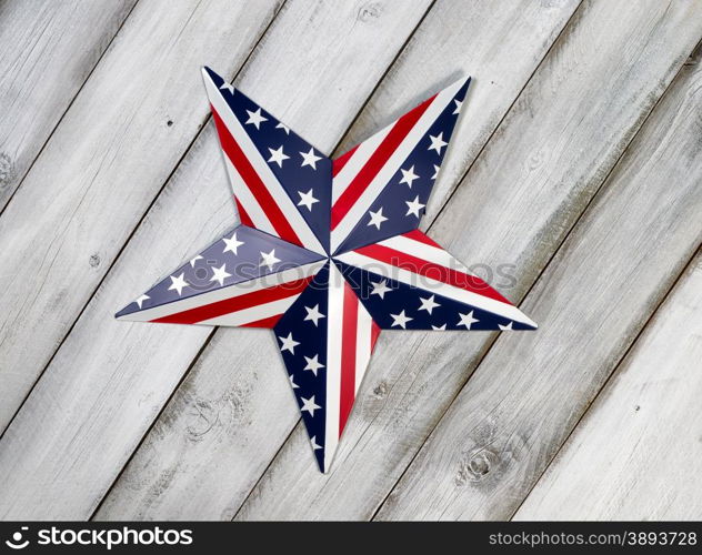 Fourth of July holiday star on rustic white wooden boards.