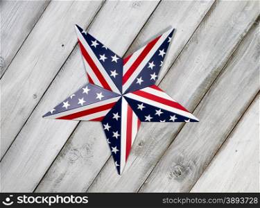 Fourth of July holiday star on rustic white wooden boards.