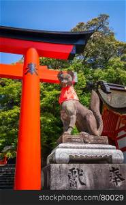 Fox statue at Fushimi Inari Taisha torii shrine, Kyoto, Japan. Fox statue at Fushimi Inari Taisha, Kyoto, Japan