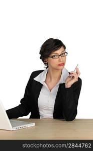 Foxy businesswoman using a laptop computer