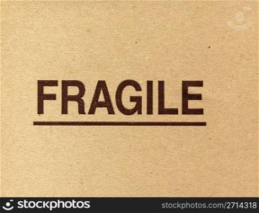 Fragile. Fragile written on a corrugated cardboard packet