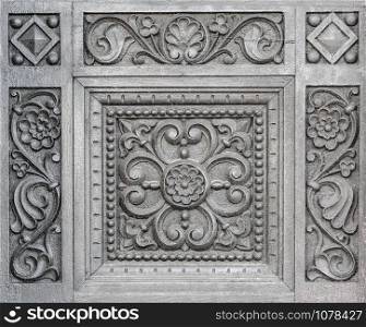 fragment of a carved wooden door in Timisoara, Romania