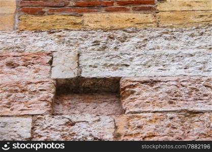 Fragment of a wall from stone and brick