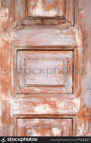 fragment of an old brown shabby door, full frame