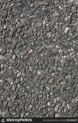 Fragment of asphalt road surface as texture close up