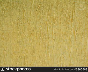 Fragment of cement yellow wall, wavy structure