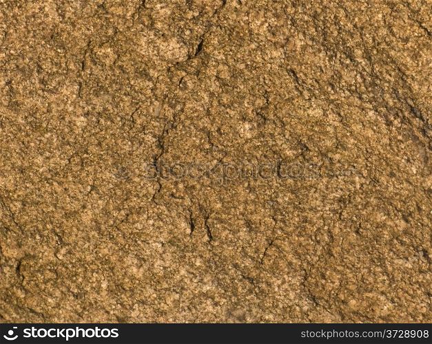 Fragment of dark brown stone background texture