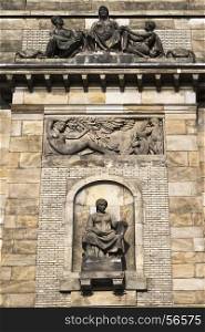 Fragment of facade with sculptures. The Ministry of Industry and Trade. Prague. Czech.