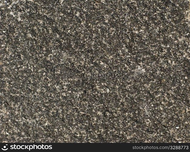 Fragment of grey stone background texture