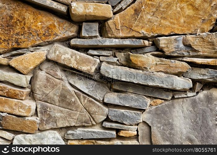 Fragment of masonry with brown stones