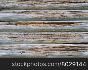 Fragment of old decomposed wooden wall background