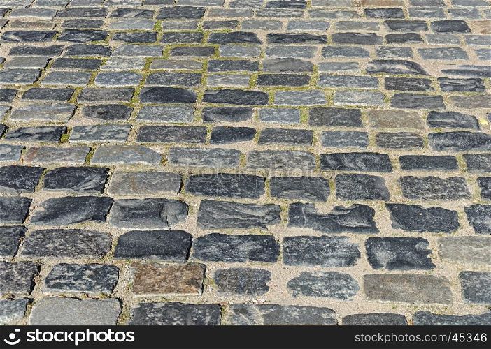 Fragment of old grey cobblestone sidewalk in Minsk