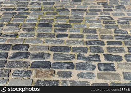 Fragment of old grey cobblestone sidewalk in Minsk
