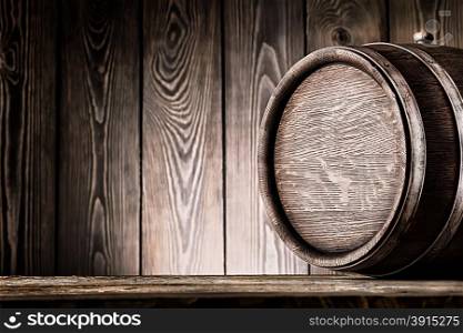 Fragment of old wooden barrels on planks background. Fragment of old wooden barrels