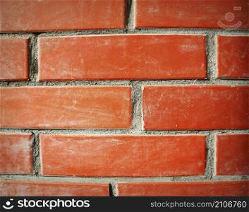 Fragment of red brick wall closeup. The structure of the background. Template for an inscription. Mockup for design. High quality photo