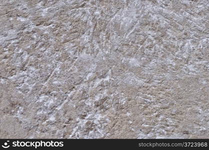 Fragment of scratched gray cement wall background