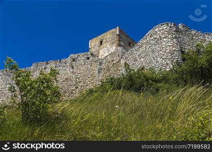 Fragment of the fortress wall and the watchtower of the Spis Castle. Slovakia