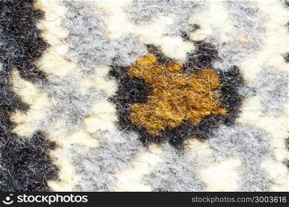 Fragment of the pattern of the carpet is made of natural wool